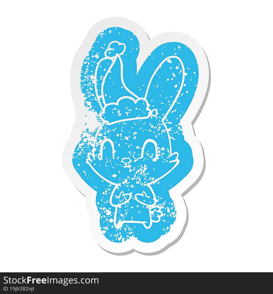 Cute Cartoon Distressed Sticker Of A Rabbit Wearing Santa Hat