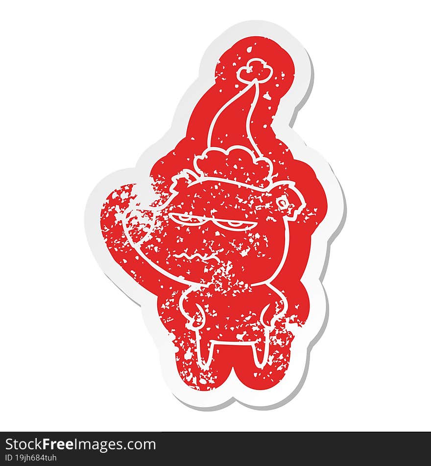 angry bear polar cartoon distressed sticker of a wearing santa hat