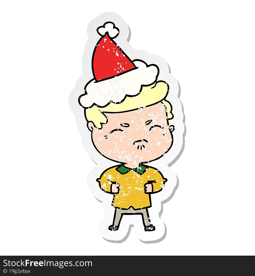 hand drawn distressed sticker cartoon of a annoyed man wearing santa hat