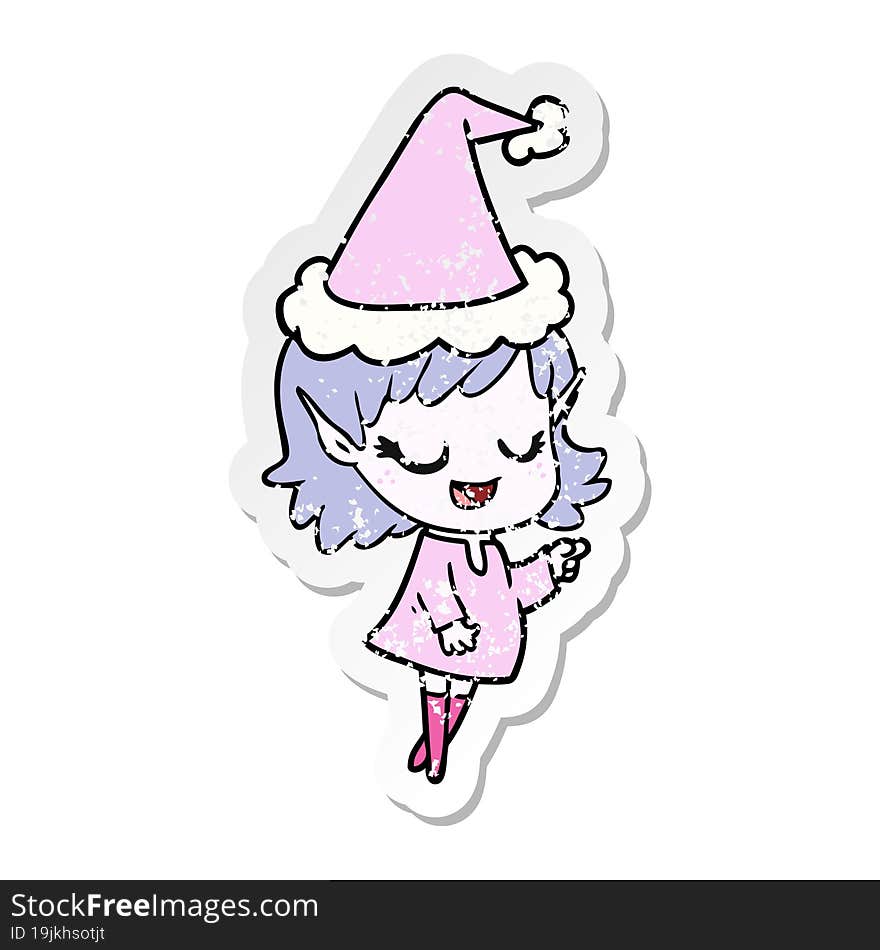 happy distressed sticker cartoon of a elf girl pointing wearing santa hat