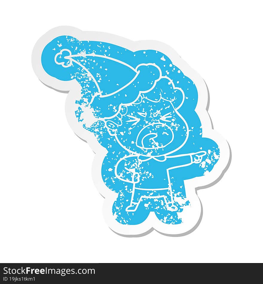 Cartoon Distressed Sticker Of A Furious Man Wearing Santa Hat