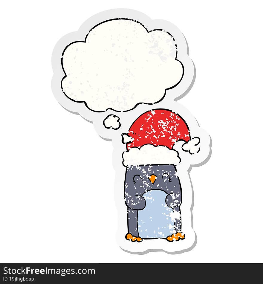 cartoon penguin and thought bubble as a distressed worn sticker