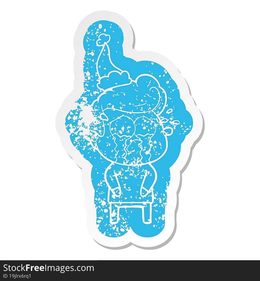 cartoon distressed sticker of a crying man wearing santa hat