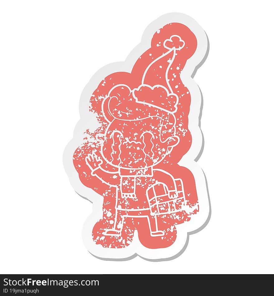 cartoon distressed sticker of a man crying wearing santa hat