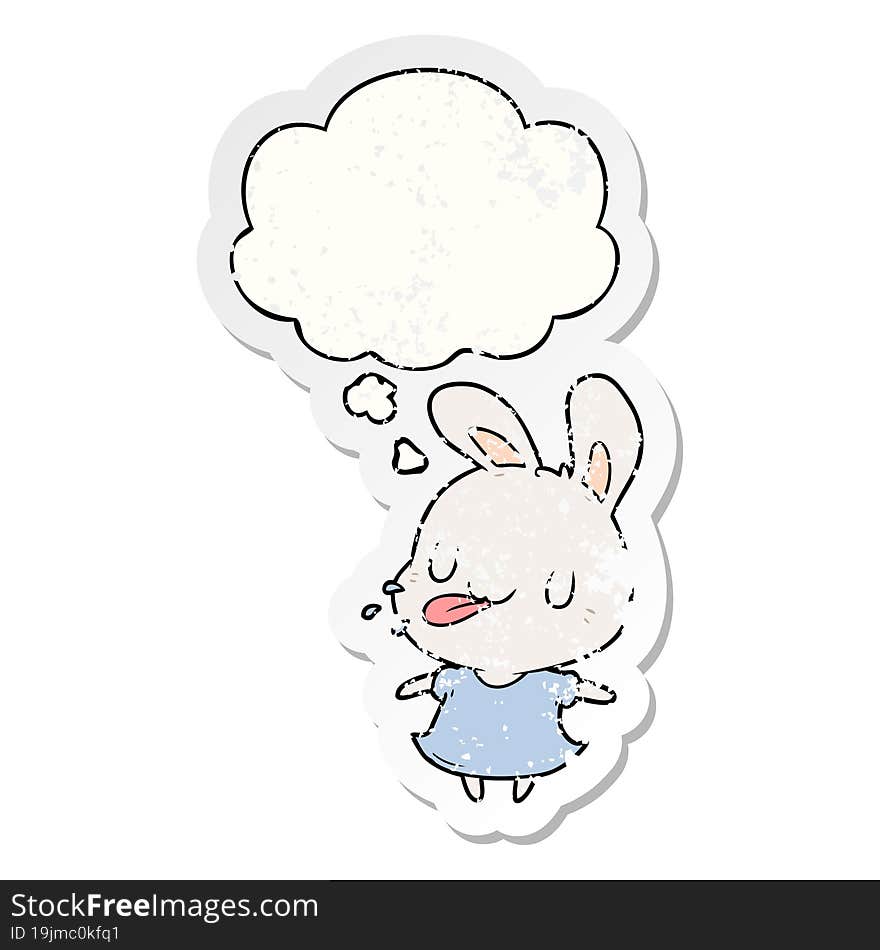 cartoon rabbit and thought bubble as a distressed worn sticker