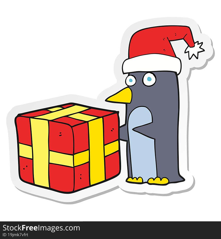 Sticker Of A Cartoon Christmas Penguin With Present