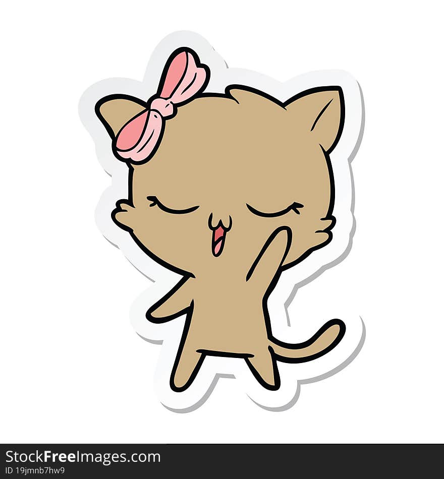 sticker of a cartoon cat with bow on head waving