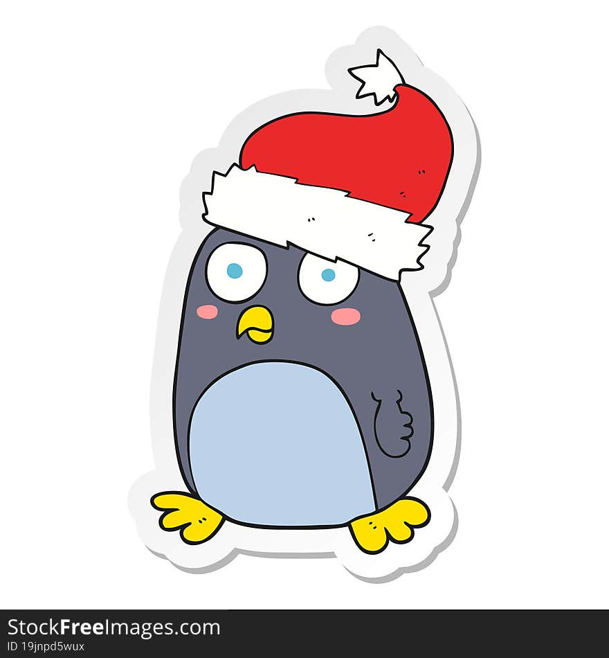 sticker of a cartoon penguin in christmas hat