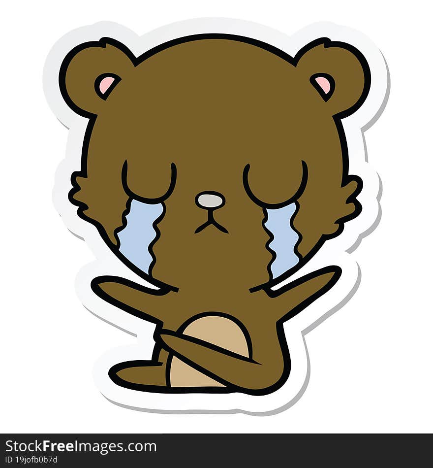 sticker of a crying cartoon bear