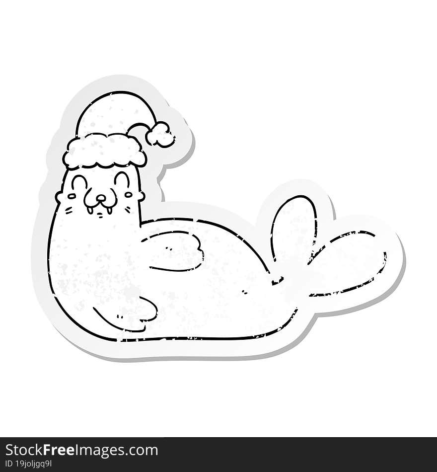 distressed sticker of a cartoon christmas walrus