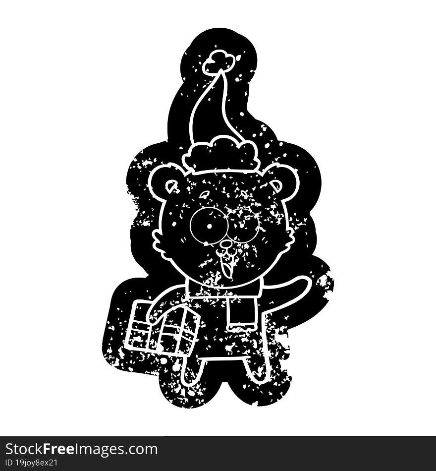 laughing teddy  bear with christmas present wearing santa hat