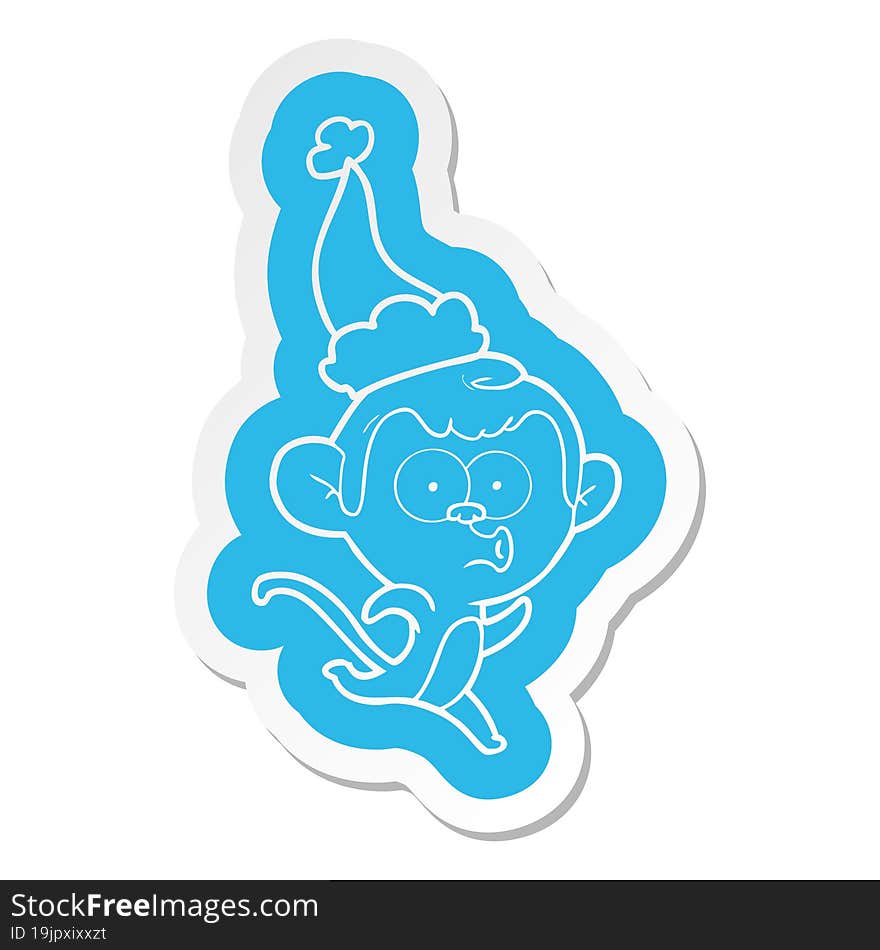 cartoon  sticker of a surprised monkey wearing santa hat