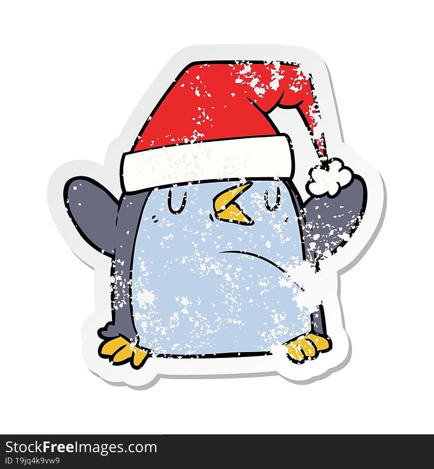 distressed sticker of a cartoon penguin wearing christmas hat