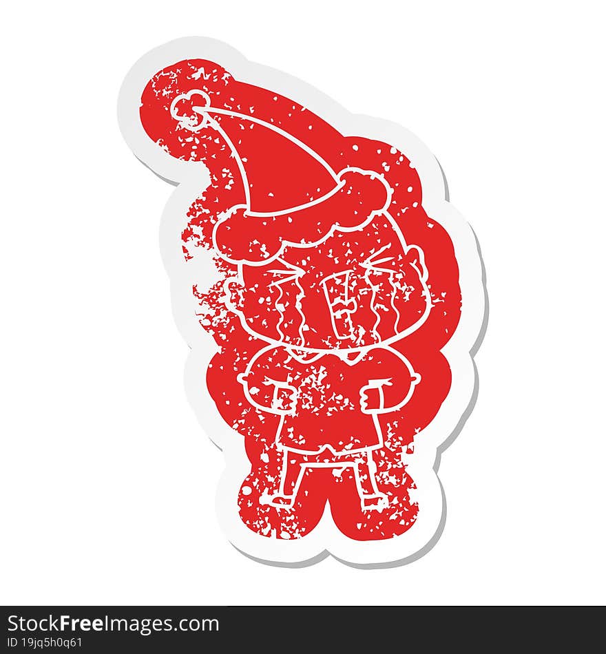 Cartoon Distressed Sticker Of A Crying Bald Man Wearing Santa Hat