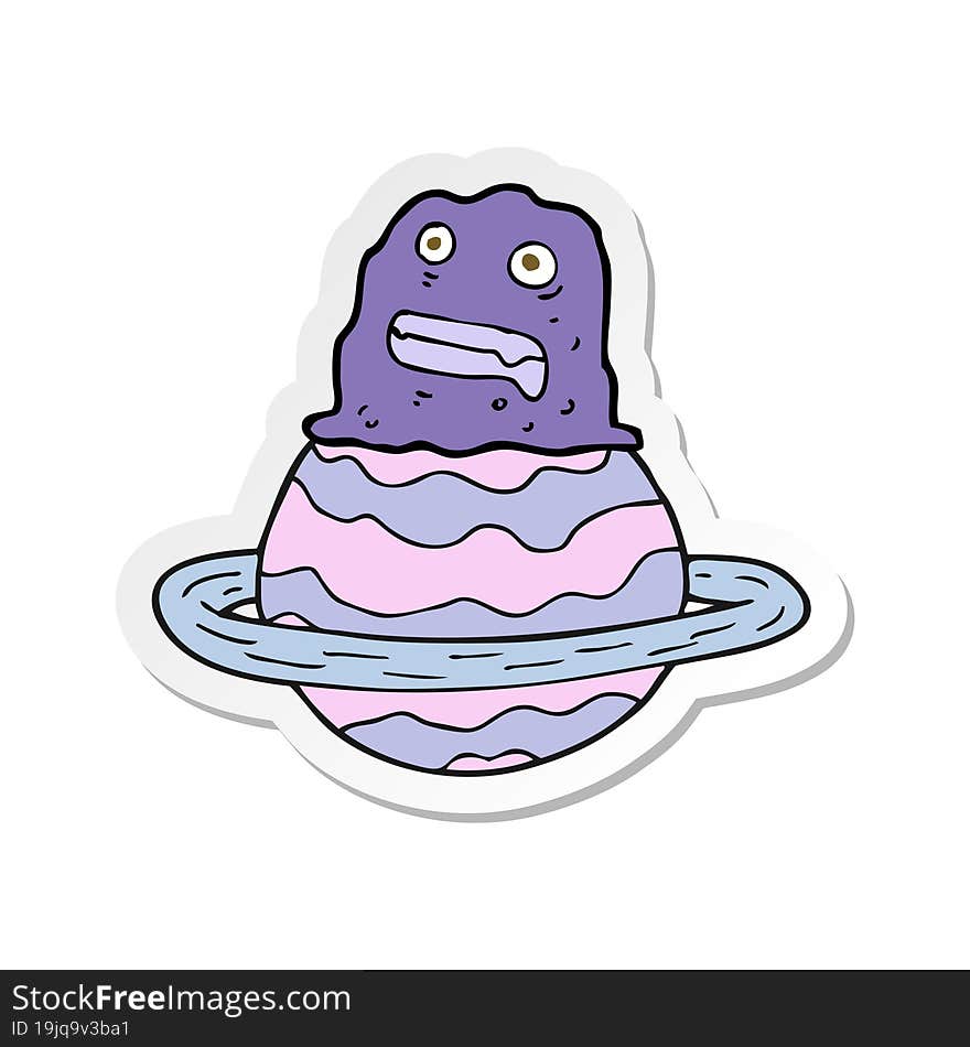 sticker of a cartoon alien on planet