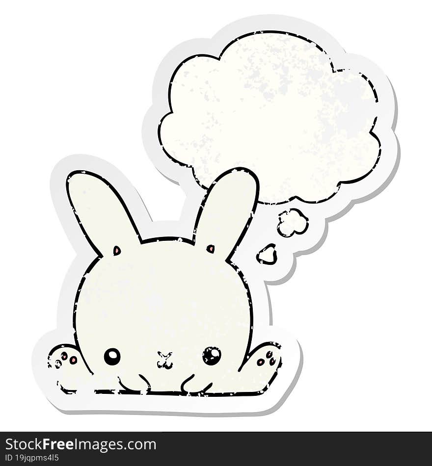 cartoon rabbit with thought bubble as a distressed worn sticker