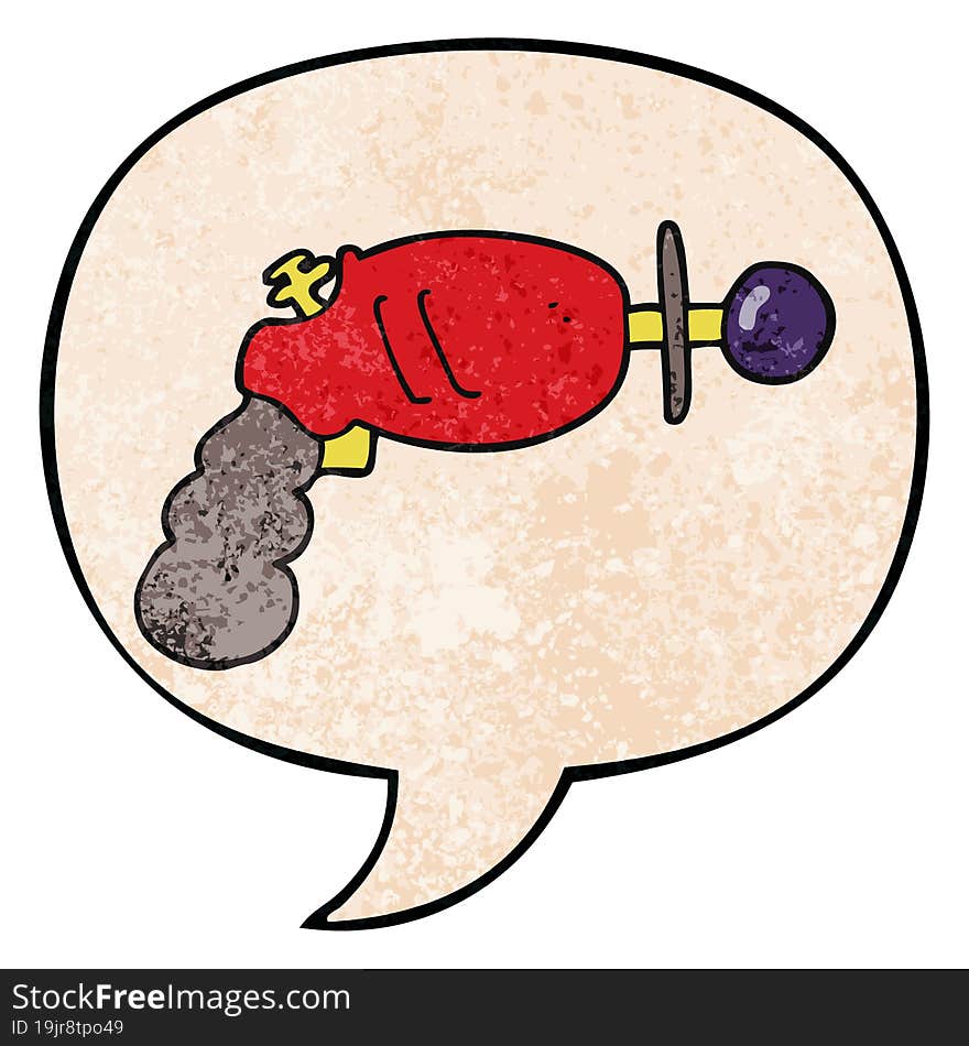 cartoon ray gun and speech bubble in retro texture style