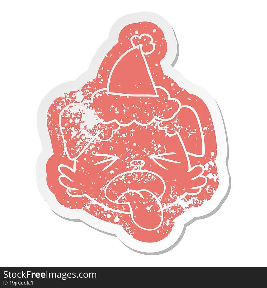 quirky cartoon distressed sticker of a dog face wearing santa hat