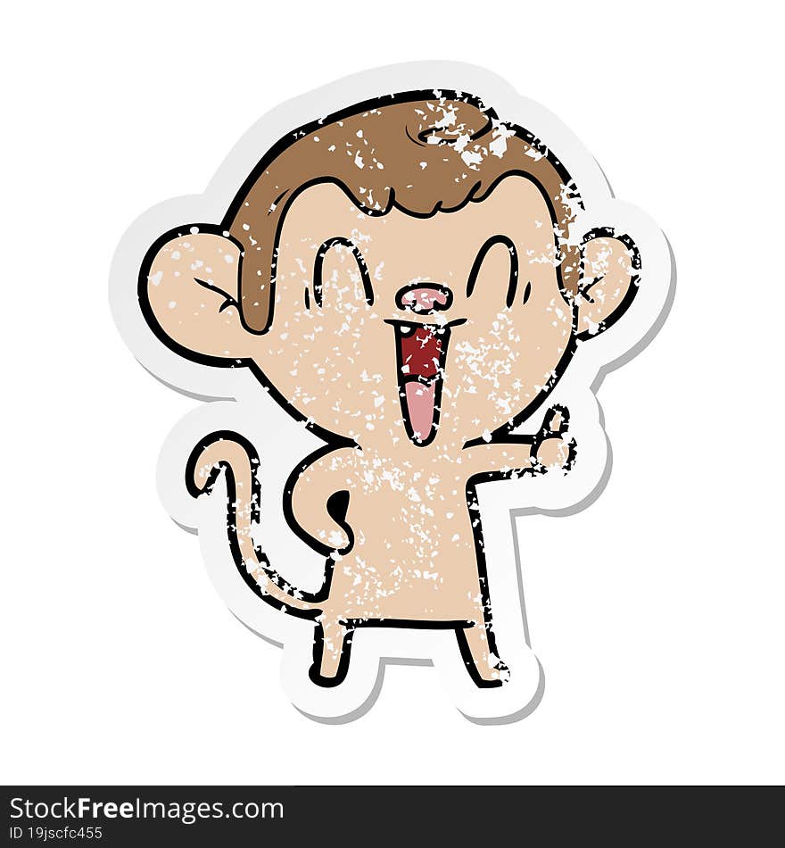 distressed sticker of a cartoon laughing monkey