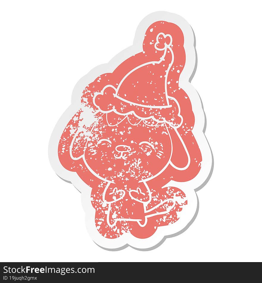 happy quirky cartoon distressed sticker of a dog wearing santa hat