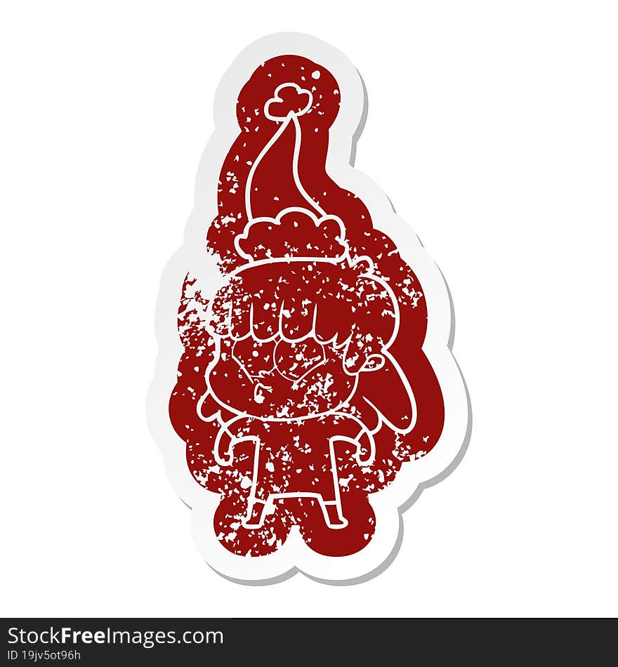 cartoon distressed sticker of a whistling girl wearing santa hat