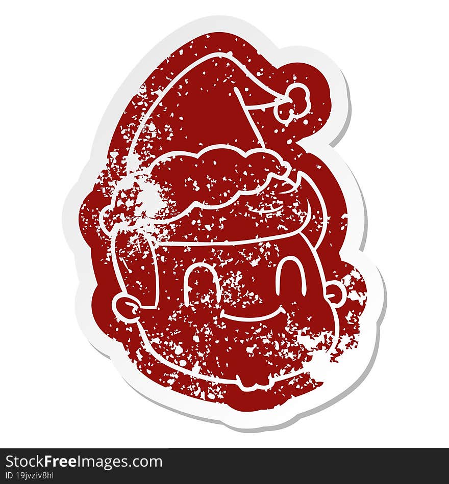 cartoon distressed sticker of a male face wearing santa hat