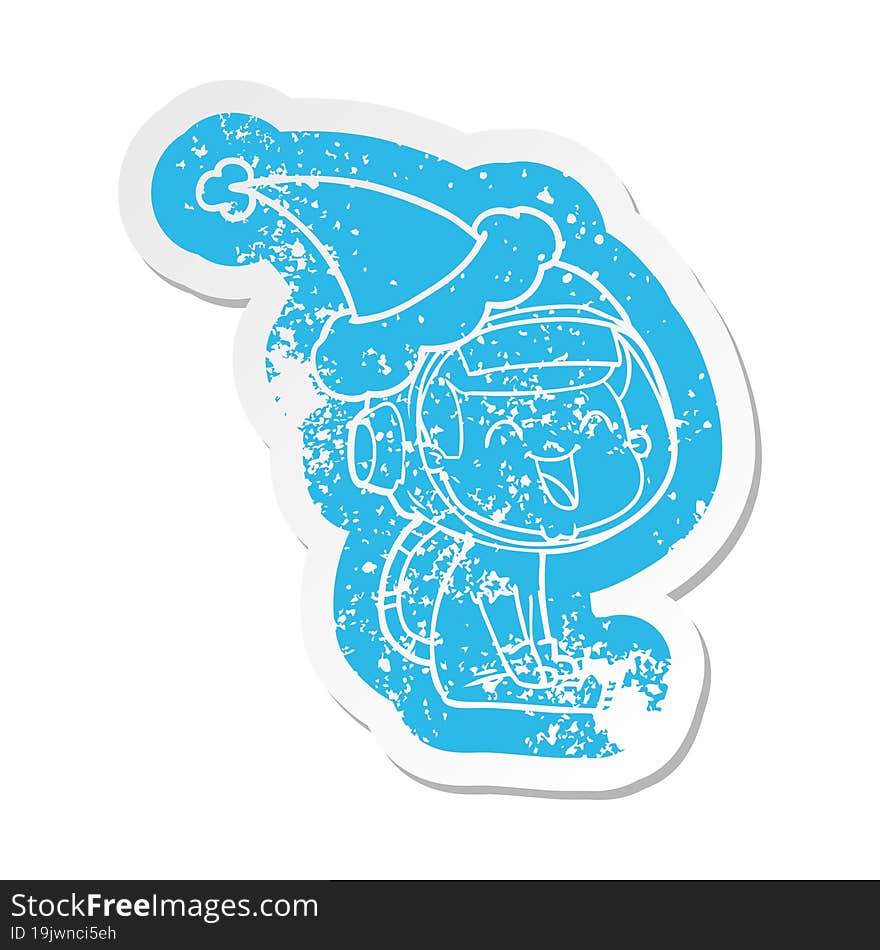 Happy Cartoon Distressed Sticker Of A Astronaut Wearing Santa Hat