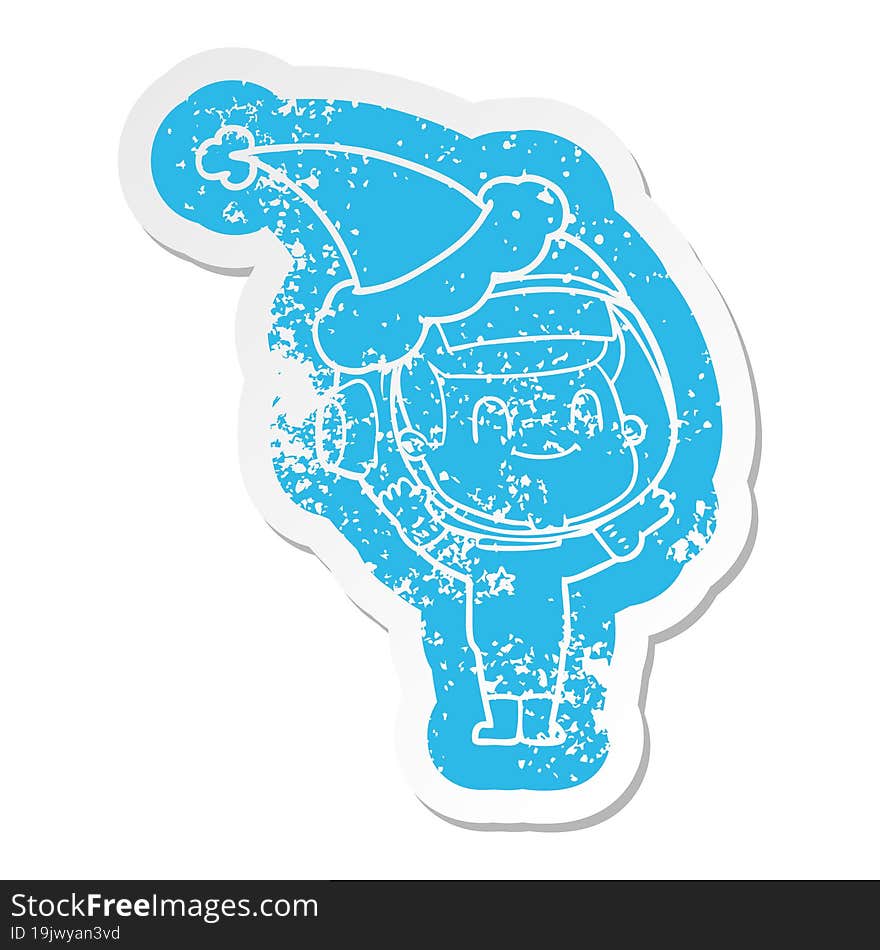 Happy Cartoon Distressed Sticker Of A Astronaut Man Wearing Santa Hat