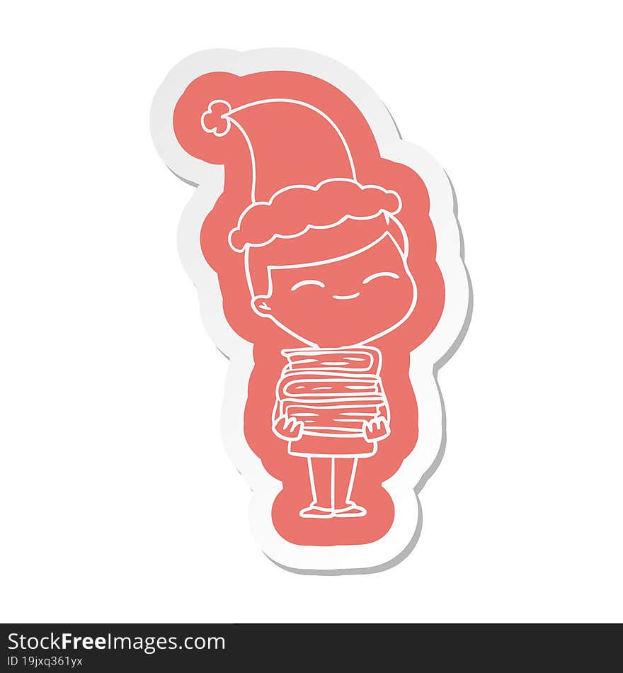 Cartoon  Sticker Of A Smiling Boy With Stack Of Books Wearing Santa Hat