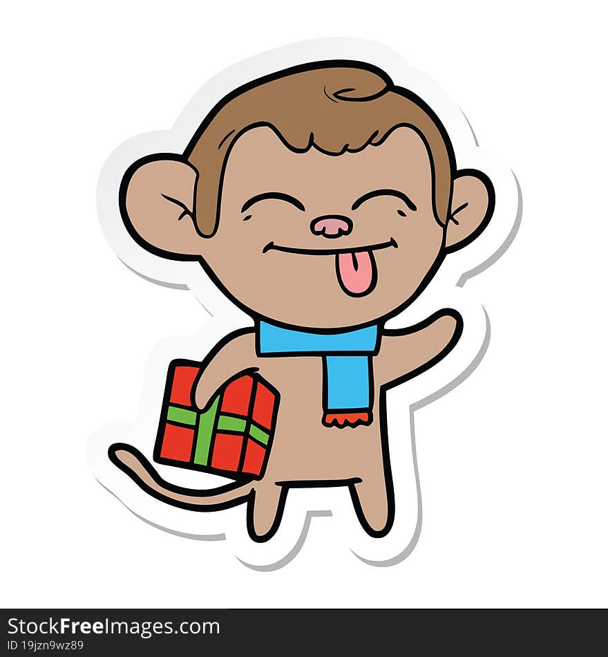 sticker of a funny cartoon monkey with christmas present