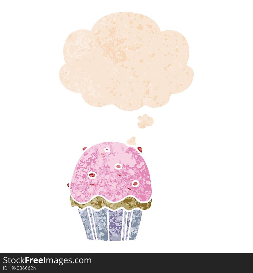 cartoon cupcake with thought bubble in grunge distressed retro textured style. cartoon cupcake with thought bubble in grunge distressed retro textured style