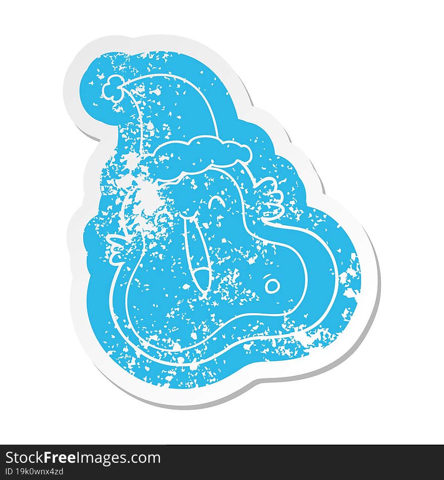 quirky cartoon distressed sticker of a germ wearing santa hat