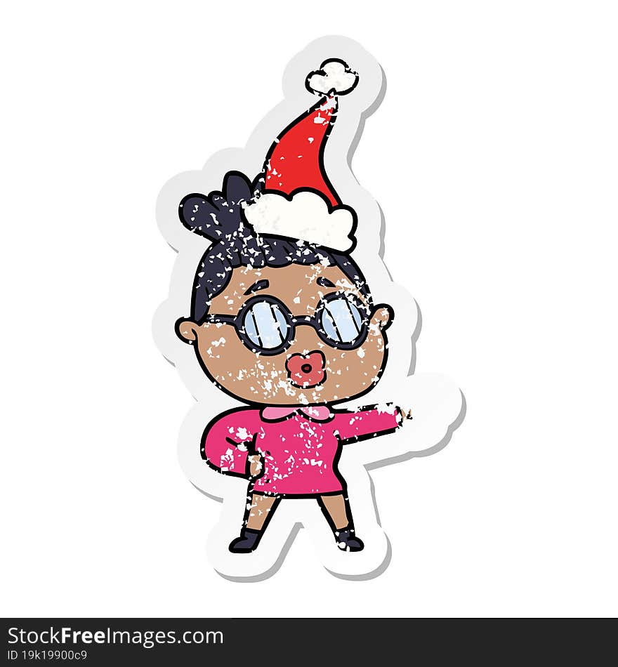 distressed sticker cartoon of a pointing woman wearing spectacles wearing santa hat