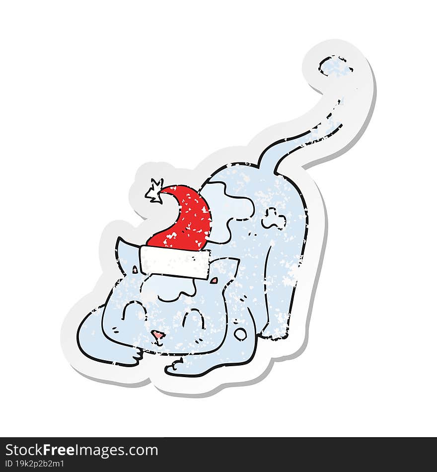 Retro Distressed Sticker Of A Cartoon Cat Wearing Christmas Hat