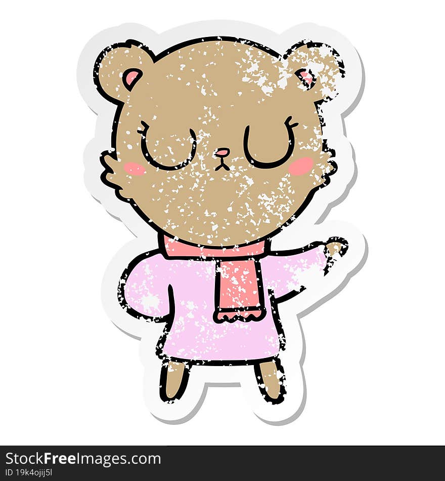 distressed sticker of a peaceful cartoon bear wearing scarf