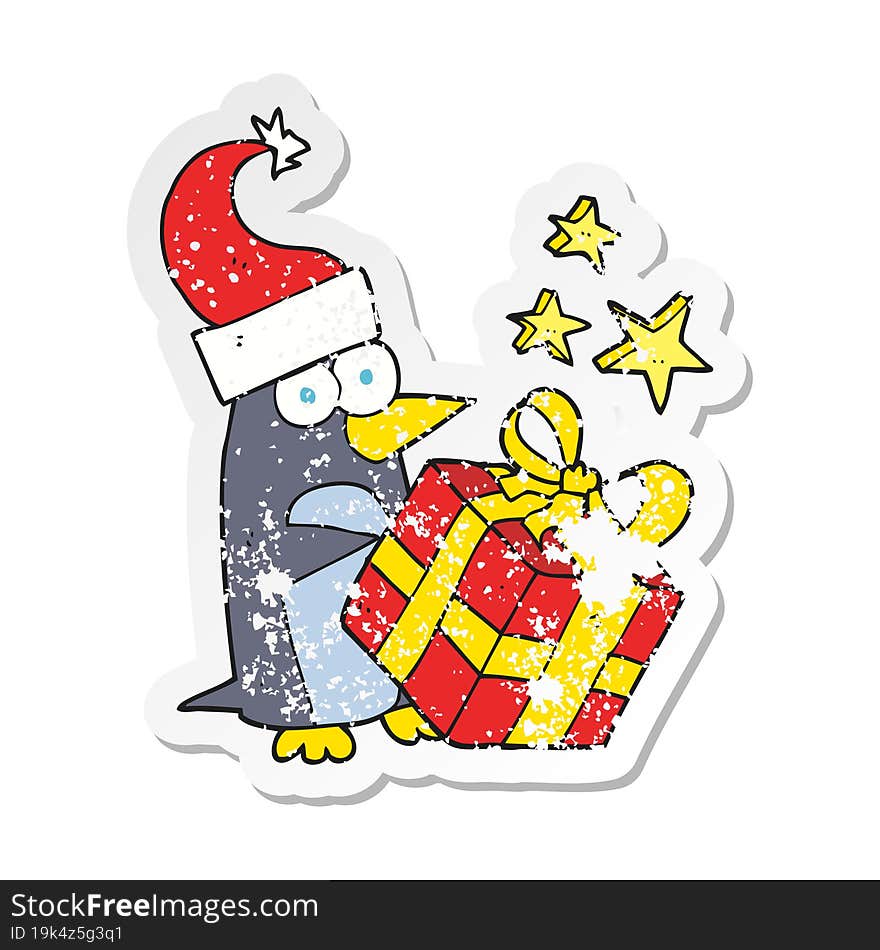 Retro Distressed Sticker Of A Cartoon Christmas Penguin With Present