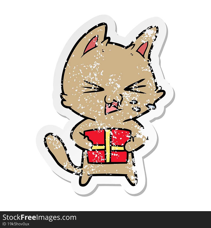 Distressed Sticker Of A Cartoon Hissing Cat With Christmas Present