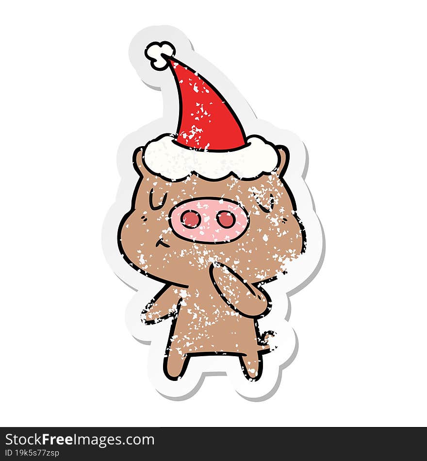 distressed sticker cartoon of a content pig wearing santa hat