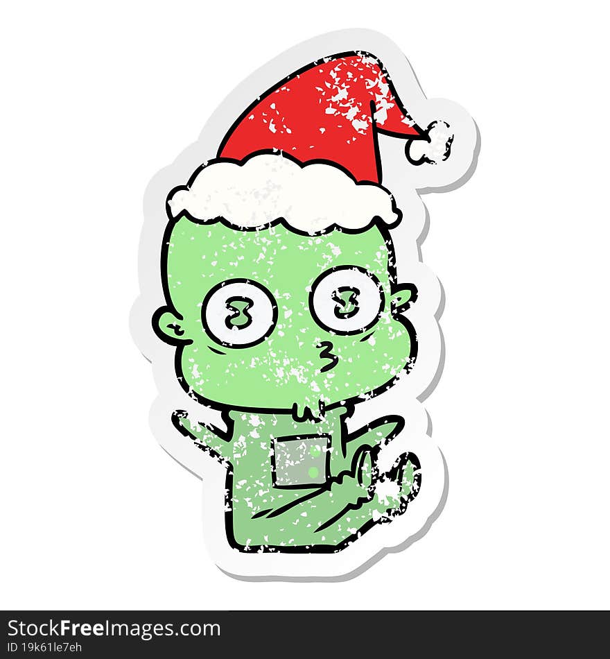 distressed sticker cartoon of a weird bald spaceman wearing santa hat