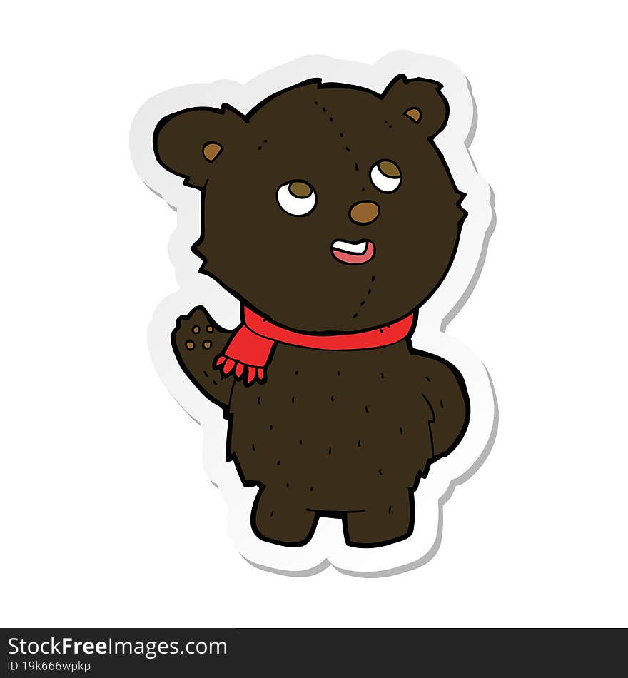 sticker of a cartoon cute black bear cub