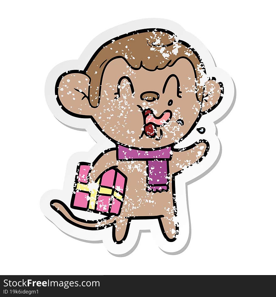 distressed sticker of a crazy cartoon monkey with christmas present