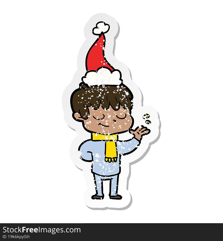 distressed sticker cartoon of a happy boy wearing santa hat