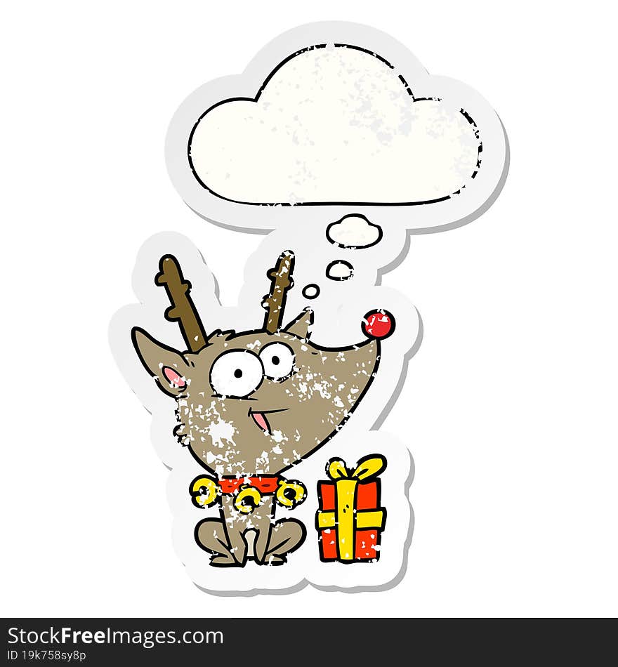 cartoon christmas reindeer and thought bubble as a distressed worn sticker