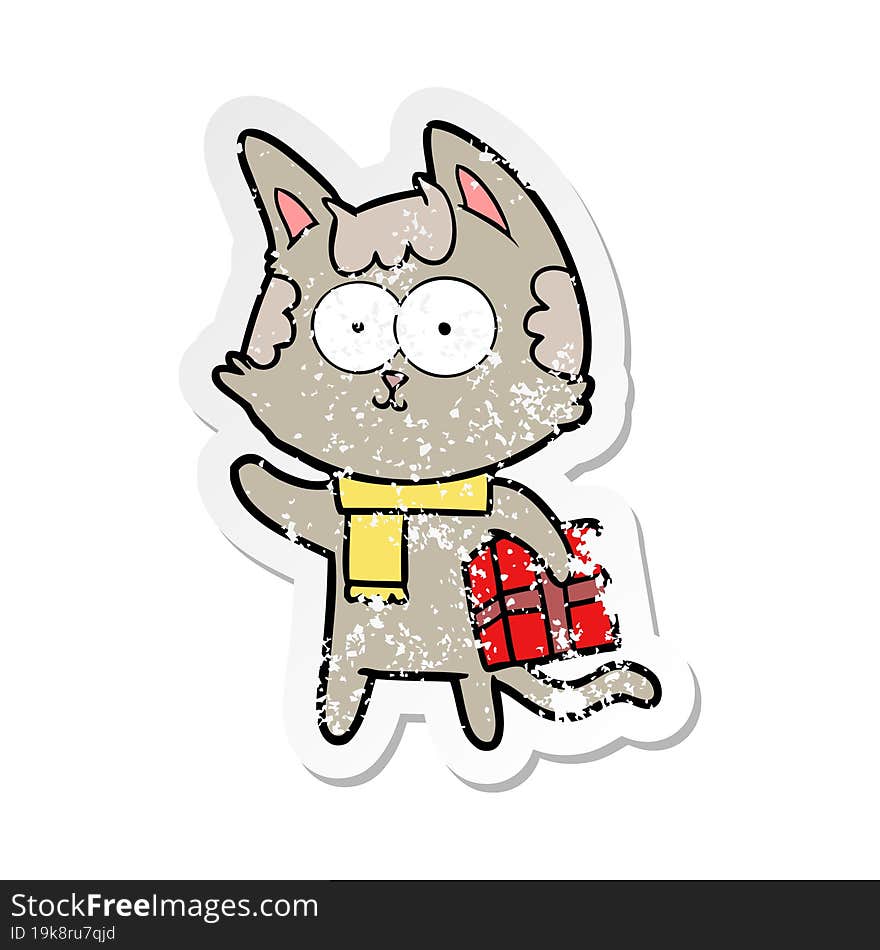 distressed sticker of a happy cartoon cat with christmas present