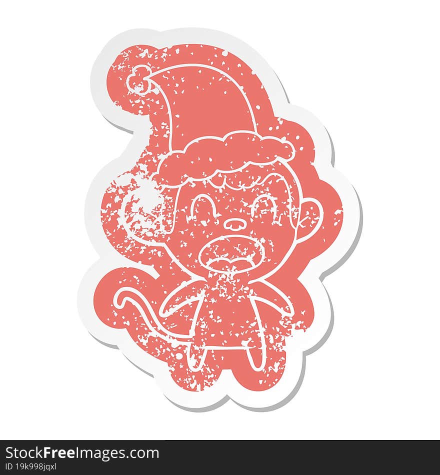 shouting cartoon distressed sticker of a monkey wearing santa hat