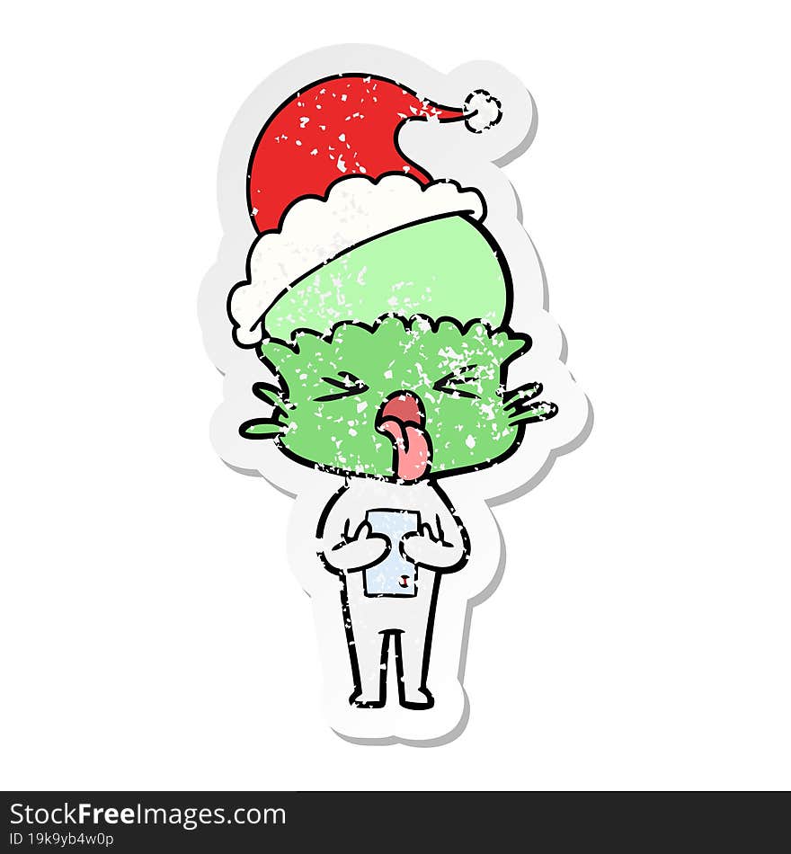 disgusted distressed sticker cartoon of a alien wearing santa hat