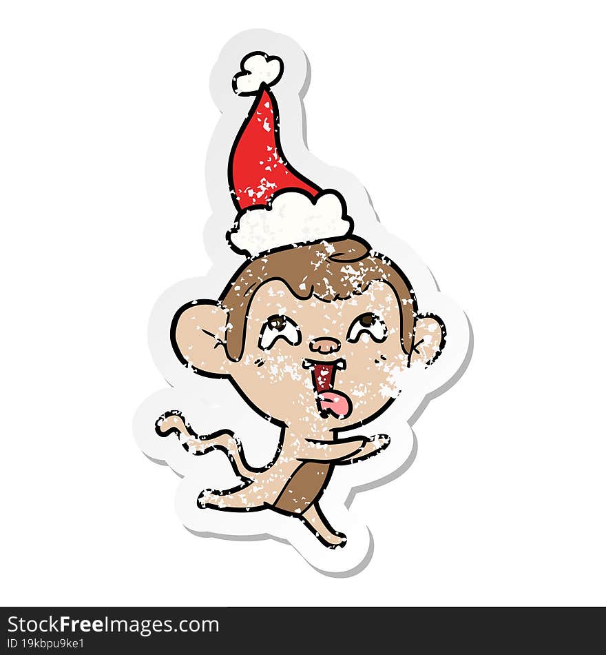 crazy distressed sticker cartoon of a monkey running wearing santa hat