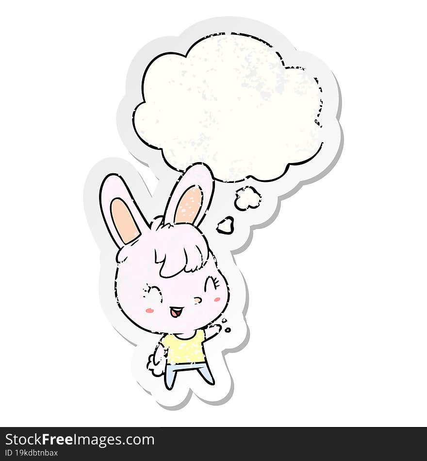 cartoon rabbit with thought bubble as a distressed worn sticker