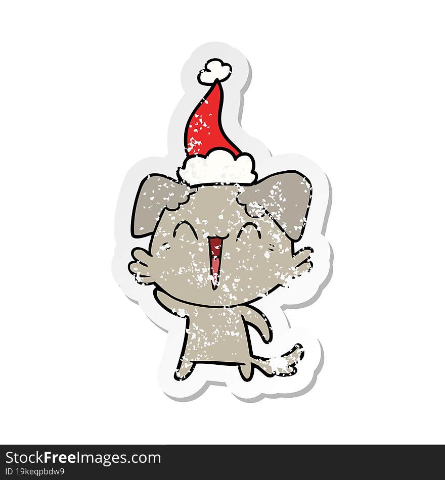 Waving Little Dog Distressed Sticker Cartoon Of A Wearing Santa Hat