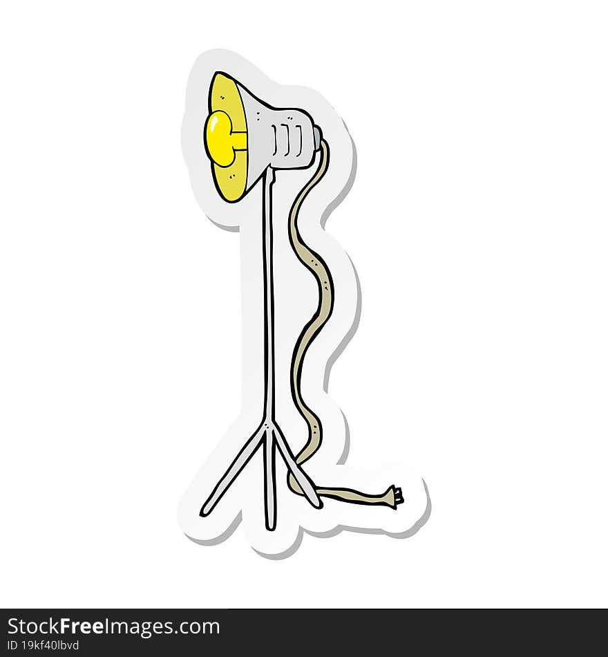 sticker of a cartoon studio lamp shining